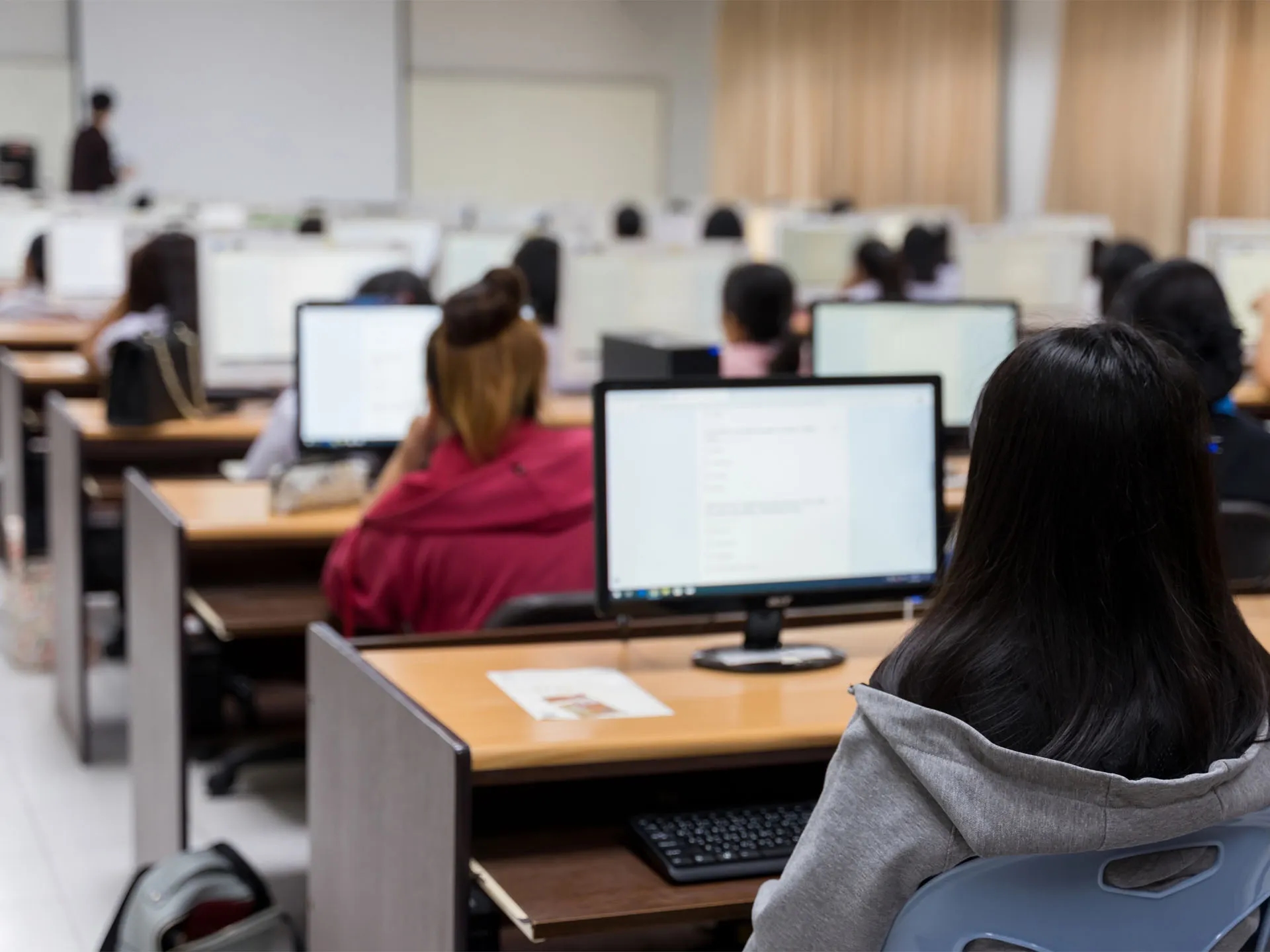 Classroom of students using desktop computers at a Minneapolis charter school supported by LXE Digital’s full-service IT consulting and technology management