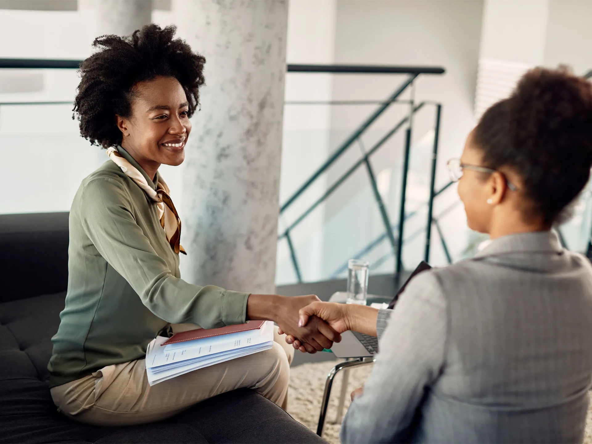 Two professionals shaking hands during a tech consulting session, representing LXE Digital’s event technology solutions for seamless conferences and conventions