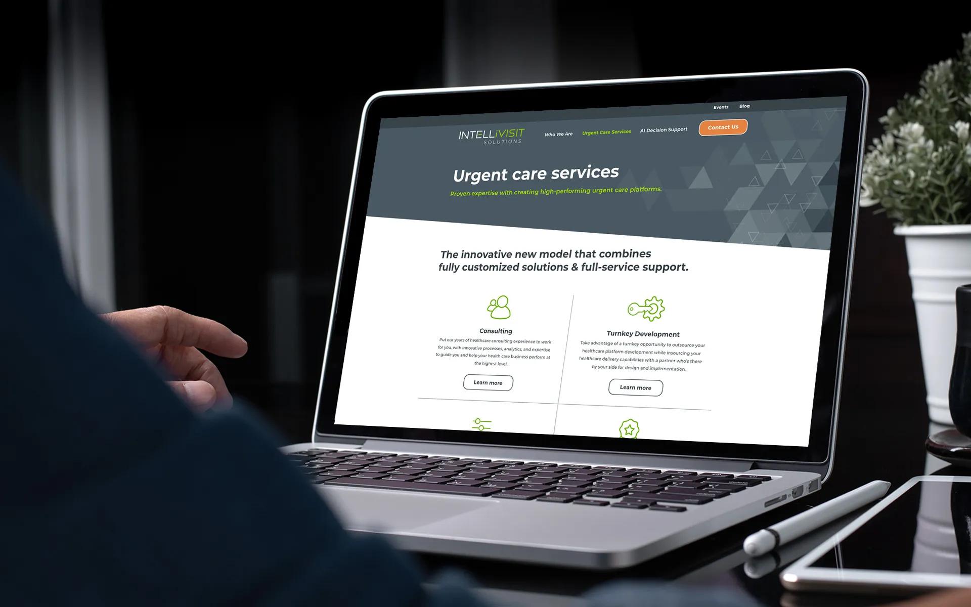 Laptop displaying the custom WordPress website LXE Digital developed for Intellivisit Solutions, an AI-powered healthcare company